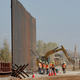 Government contractors erect a section of the border wall along the Colorado River in Yuma, Arizona, back in September 2019.